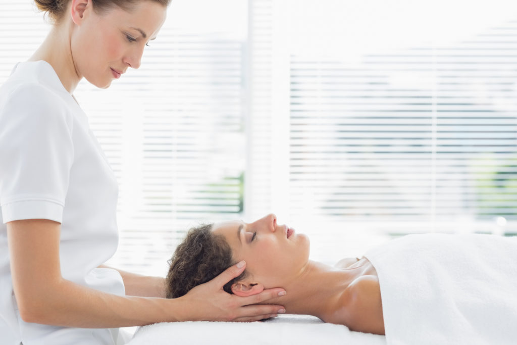 blonde physio treating neck blonde physio treating neck